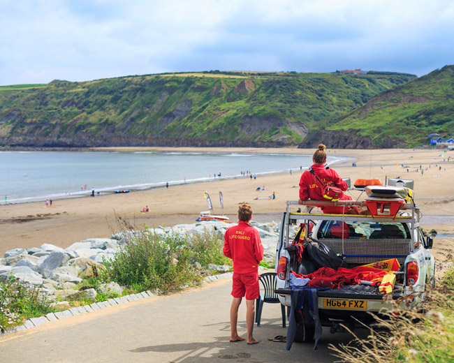 lifeguards at Runswick Bay by Robert Birkby